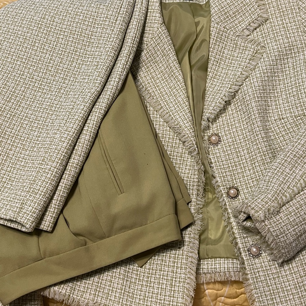 Green and white three piece suit. Jacket, pants, skirt.